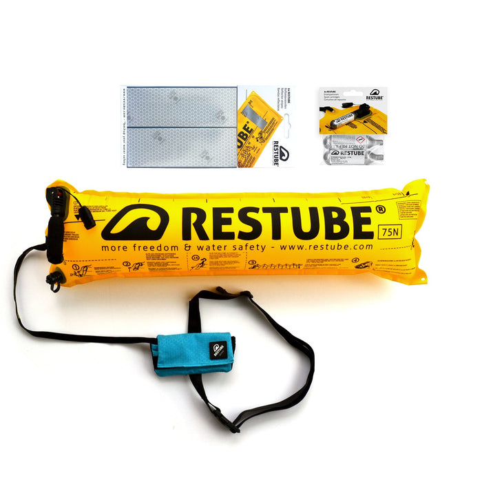 Restube active starter package reflector strips, two CO2 replacement cartridges and inflated Restube active the bag is light blue