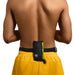 Swimmer in yellow swimming shorts puts his Restube beach swimming buoy on belt around waist