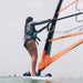 Windsurfer gliding over the water with a Restube extreme and your surfboard.